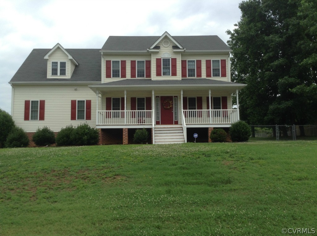 5412 Takach Road Prince George, VA 23875 - Photo 1 of 24 a front view of a house with a garden