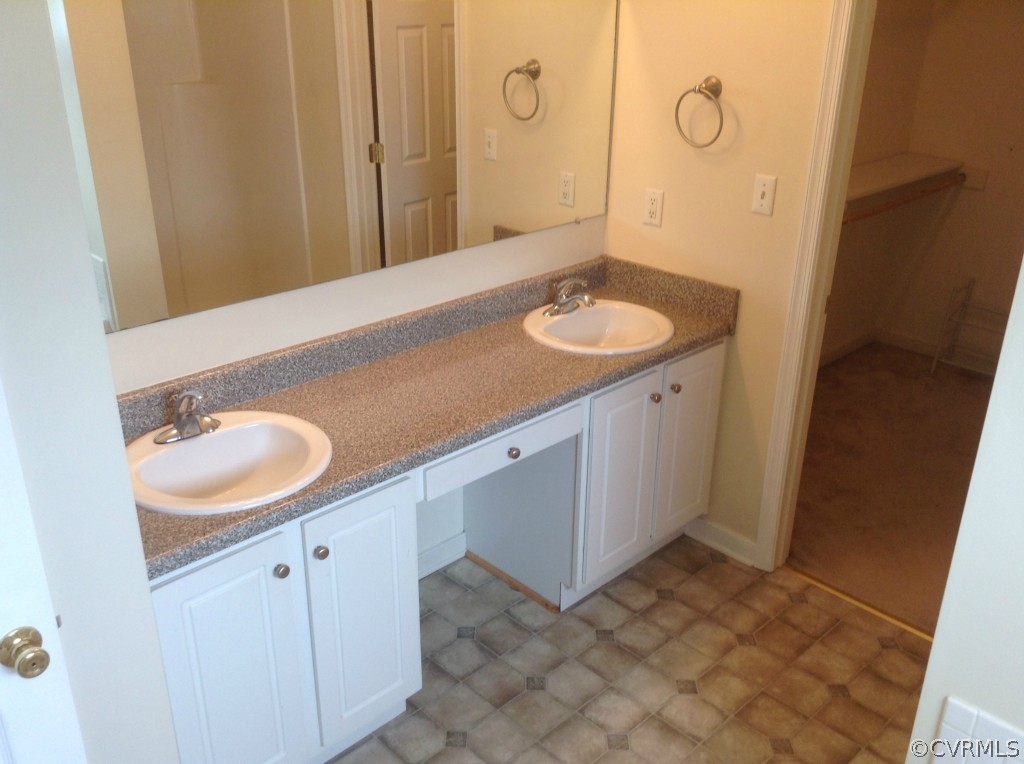 5412 Takach Road Prince George, VA 23875 - Photo 12 of 24 a bathroom with a sink and a mirror