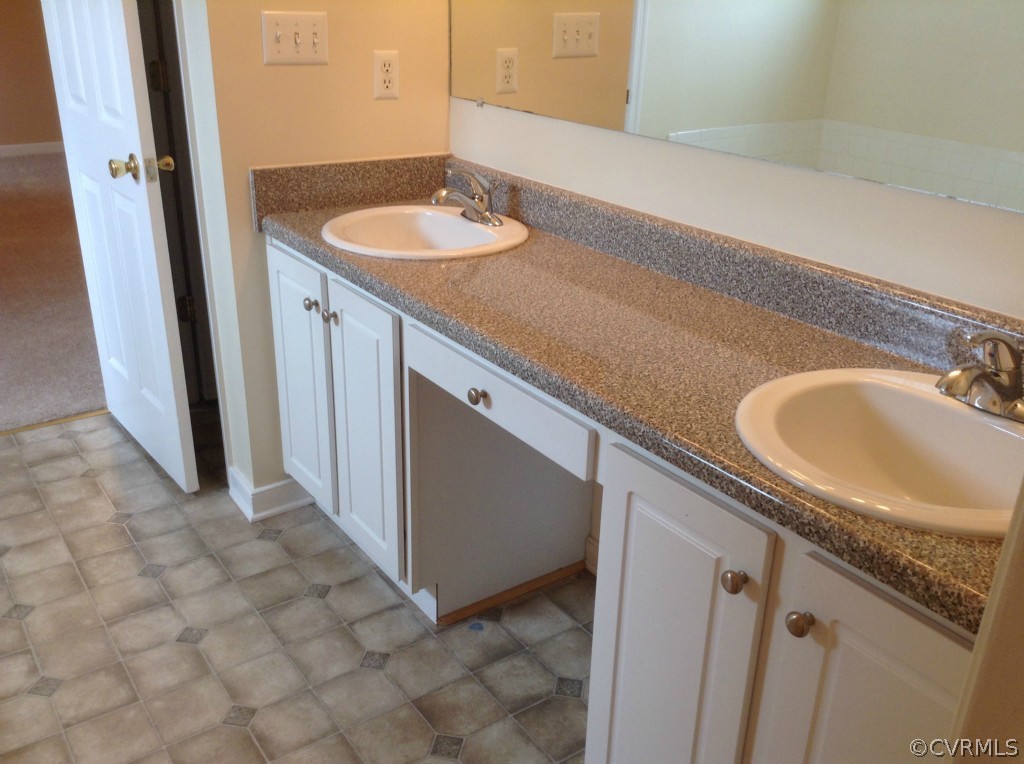 5412 Takach Road Prince George, VA 23875 - Photo 14 of 24 a bathroom with a sink and a mirror