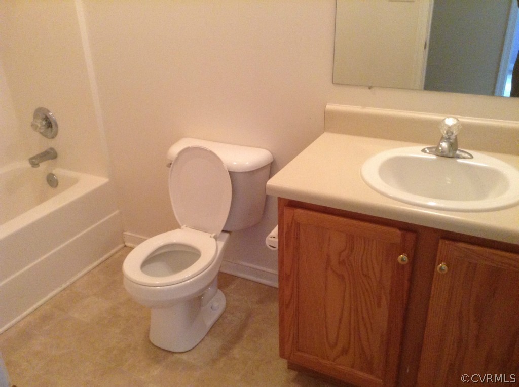 5412 Takach Road Prince George, VA 23875 - Photo 17 of 24 a bathroom with a sink toilet and shower