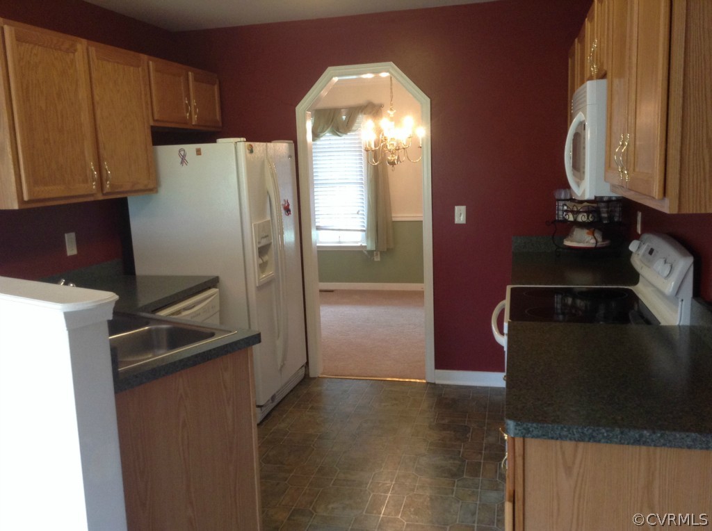 5412 Takach Road Prince George, VA 23875 - Photo 2 of 24 a kitchen with a refrigerator and a stove