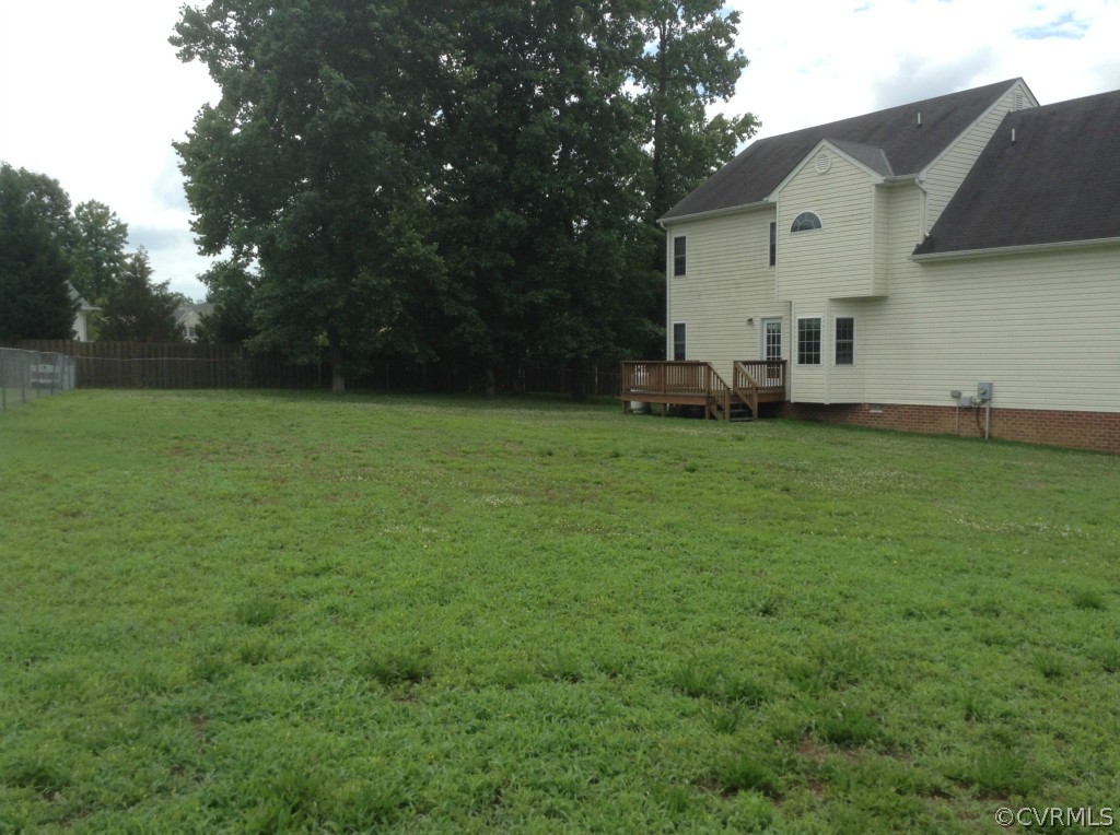 5412 Takach Road Prince George, VA 23875 - Photo 22 of 24 a view of a house with a back yard