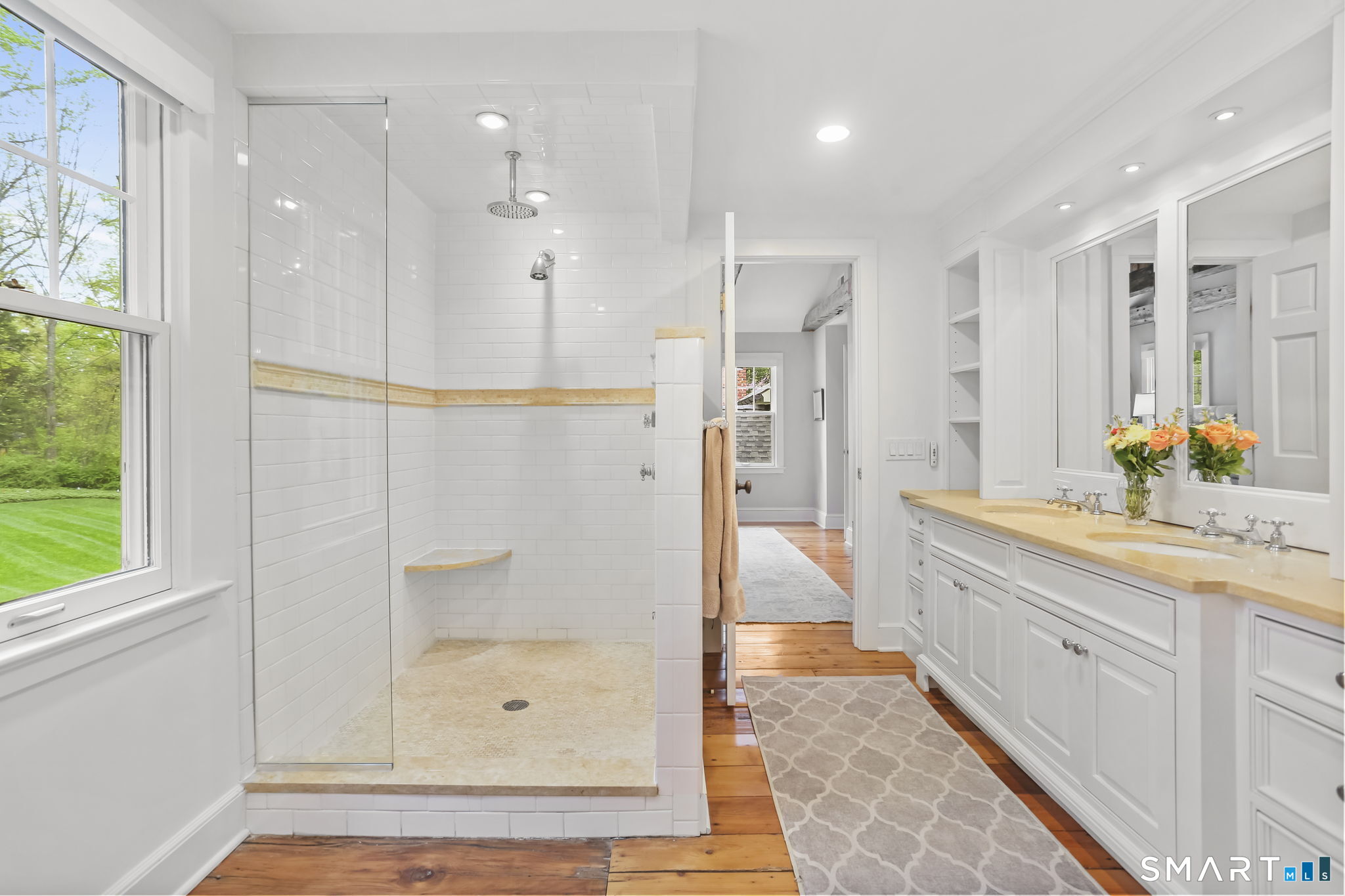 23 Old Stage Coach Road Weston, CT 06883 - Photo 20 of 37 a bathroom with a glass shower door and a sink