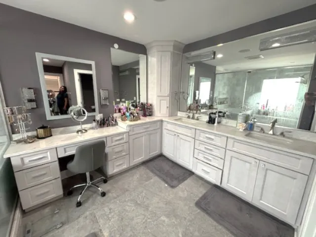a view of a kitchen counter space a sink cabinets and appliances