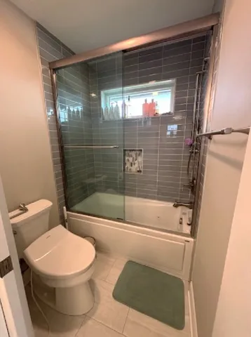 a kitchen with a sink cabinets and washer