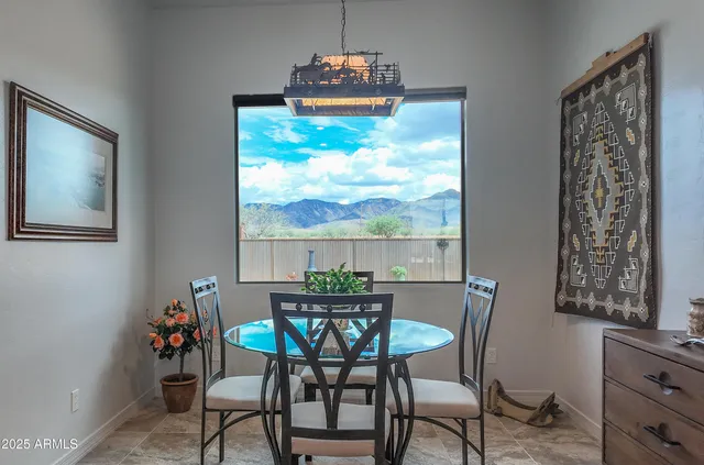 a view of a dining room with furniture window and outside view