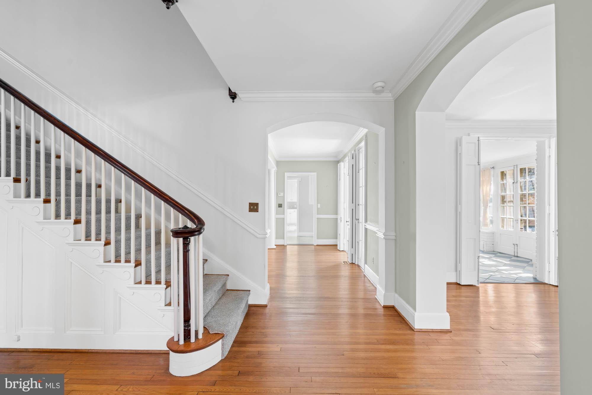7 Charlcote Place Baltimore, MD 21218 - Photo 12 of 88 a view of a hallway with wooden floor and staircase