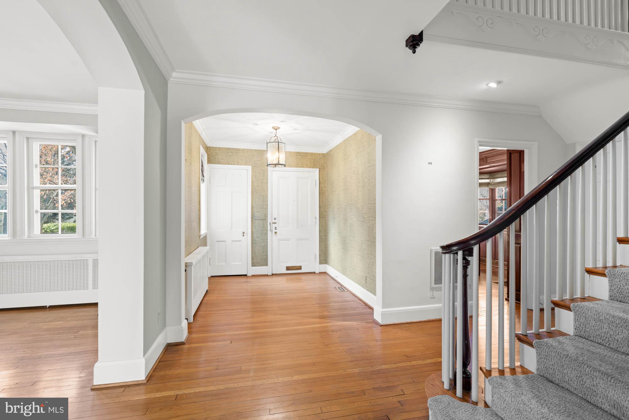 7 Charlcote Place Baltimore, MD 21218 - Photo 14 of 88 a view of a hallway with wooden floor and staircase