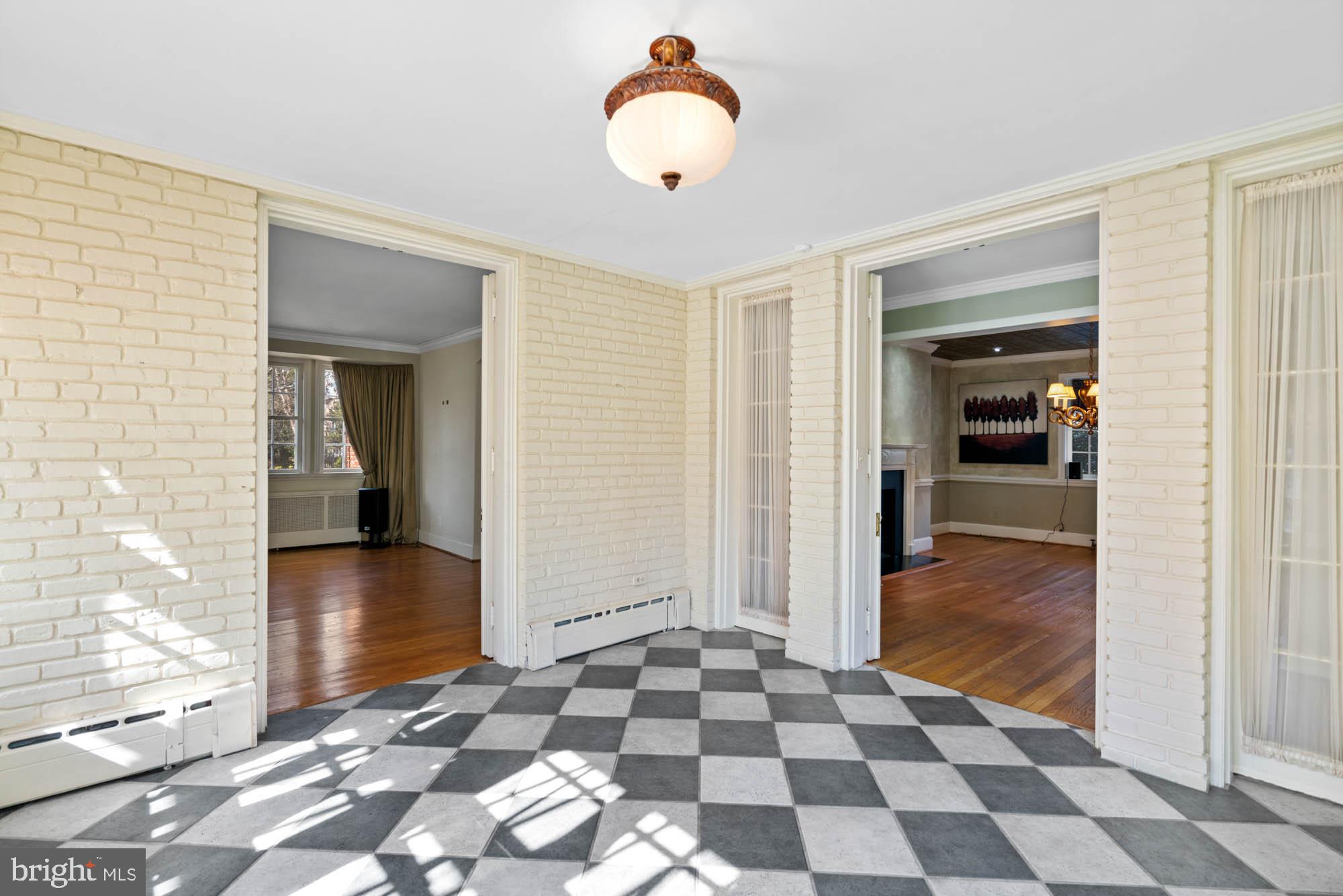 7 Charlcote Place Baltimore, MD 21218 - Photo 31 of 88 a view of a hallway with a chandelier and dining area