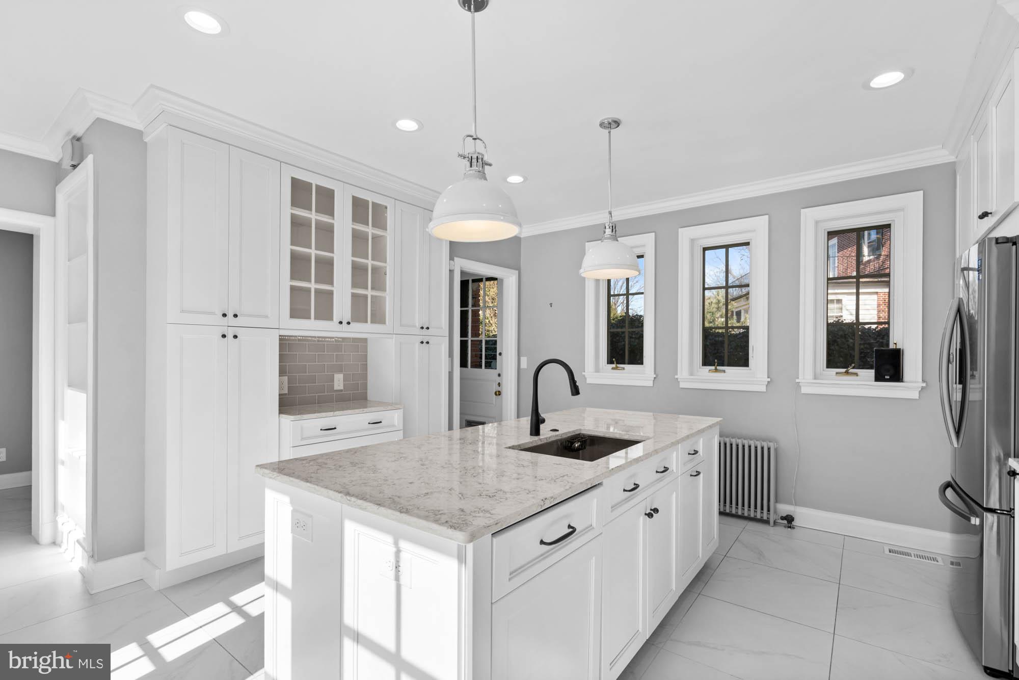 7 Charlcote Place Baltimore, MD 21218 - Photo 42 of 88 a kitchen with stainless steel appliances granite countertop a sink stove and cabinets
