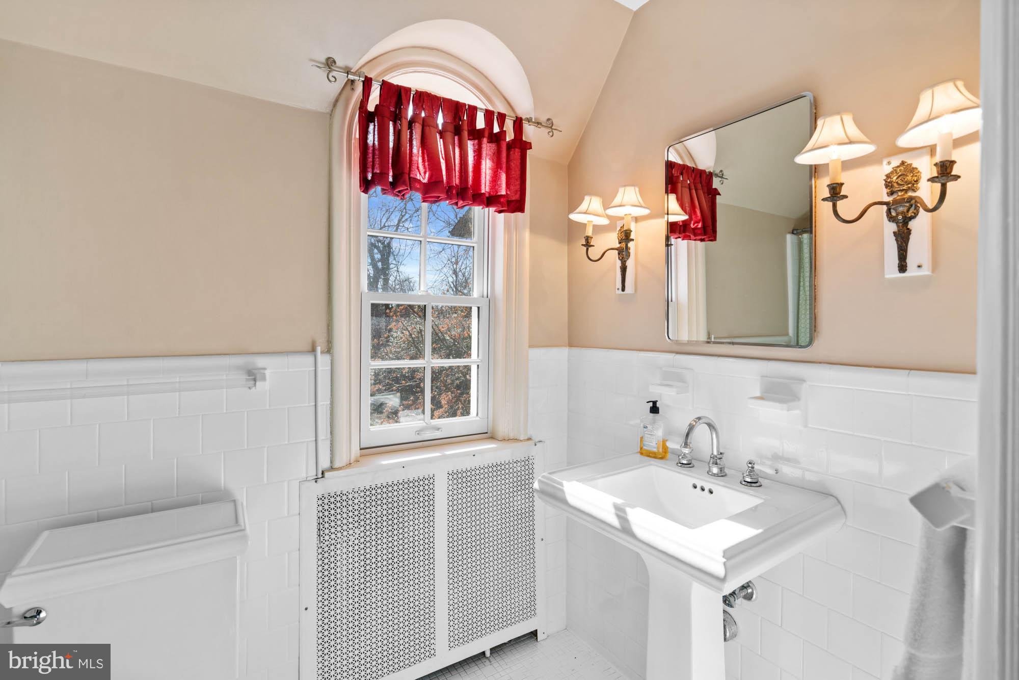 7 Charlcote Place Baltimore, MD 21218 - Photo 67 of 88 a bathroom with a sink vanity and a mirror