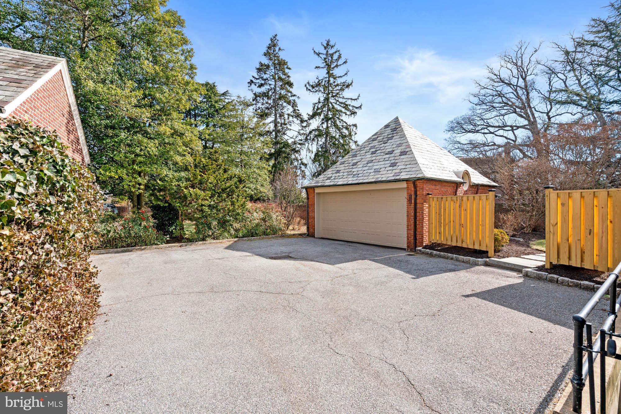 7 Charlcote Place Baltimore, MD 21218 - Photo 70 of 88 a front view of a house with a yard and garage