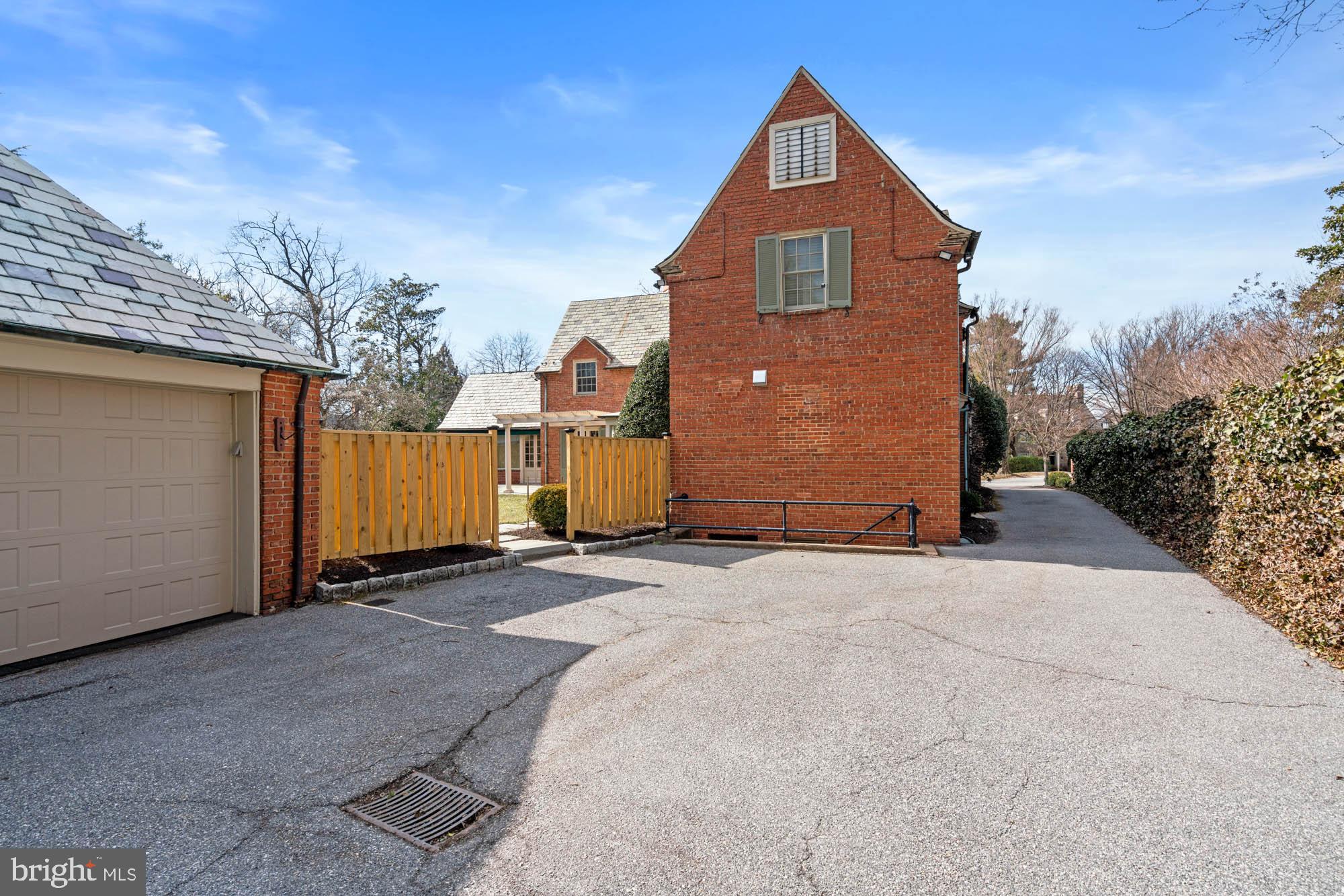 7 Charlcote Place Baltimore, MD 21218 - Photo 72 of 88 a front view of a house with a yard and garage