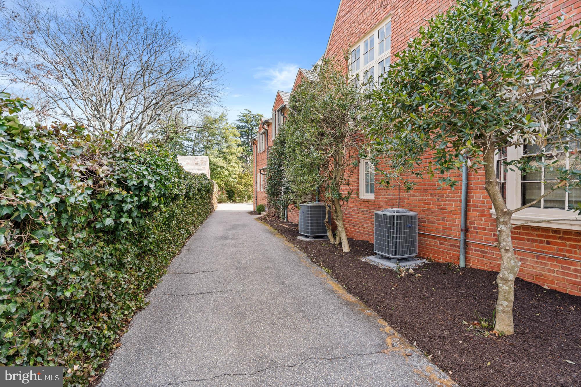 7 Charlcote Place Baltimore, MD 21218 - Photo 84 of 88 a view of a patio with table and chairs and a large tree