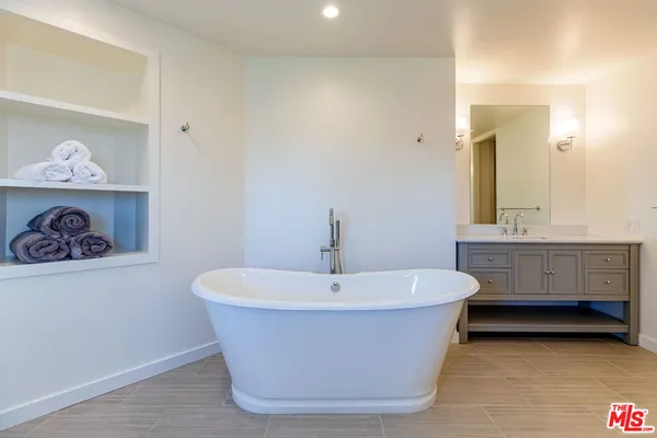 a white bath tub sitting in a bathroom