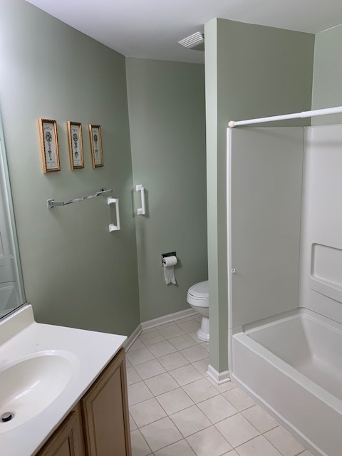 103 Bay Drive Itasca, IL 60143 - Photo 11 of 12 a bathroom with a sink a toilet and shower