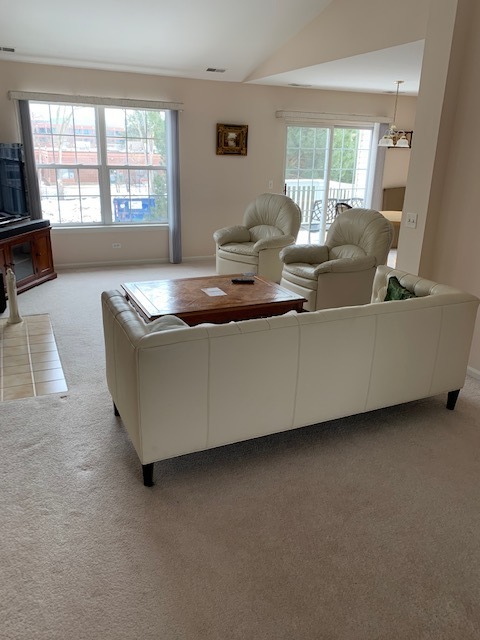 103 Bay Drive Itasca, IL 60143 - Photo 5 of 12 a living room with furniture and a flat screen tv