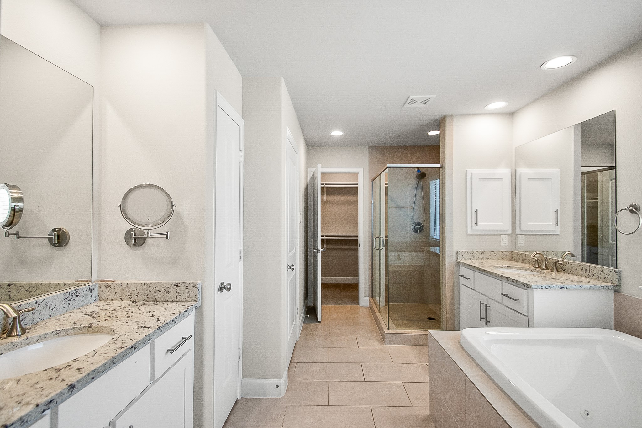 5328 Larkin Street Houston, TX 77007 - Photo 12 of 27 Well-appointed primary bath featuring granite countertops, dual vanities, and a thoughtfully designed layout for everyday convenience.