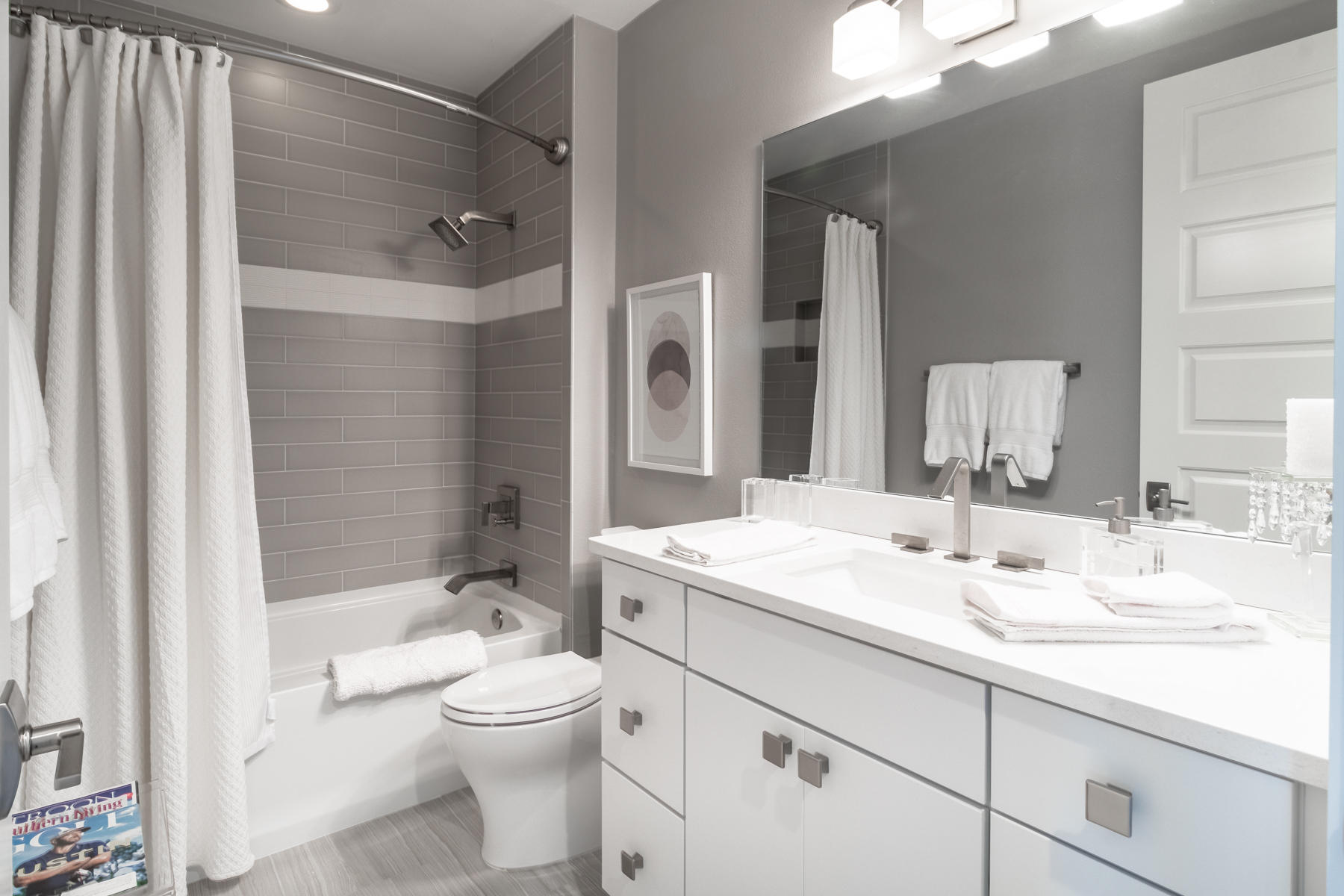 211 Durango Road, Unit 617 Destin, FL 32541 - Photo 24 of 56 a bathroom with a granite countertop sink toilet a large mirror a shower and bathtub
