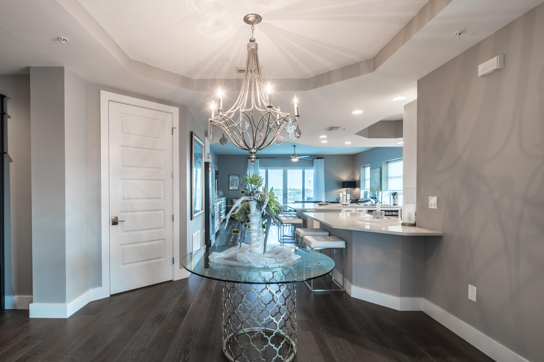 211 Durango Road, Unit 617 Destin, FL 32541 - Photo 4 of 56 a view of a dining room with furniture wooden floor and chandelier