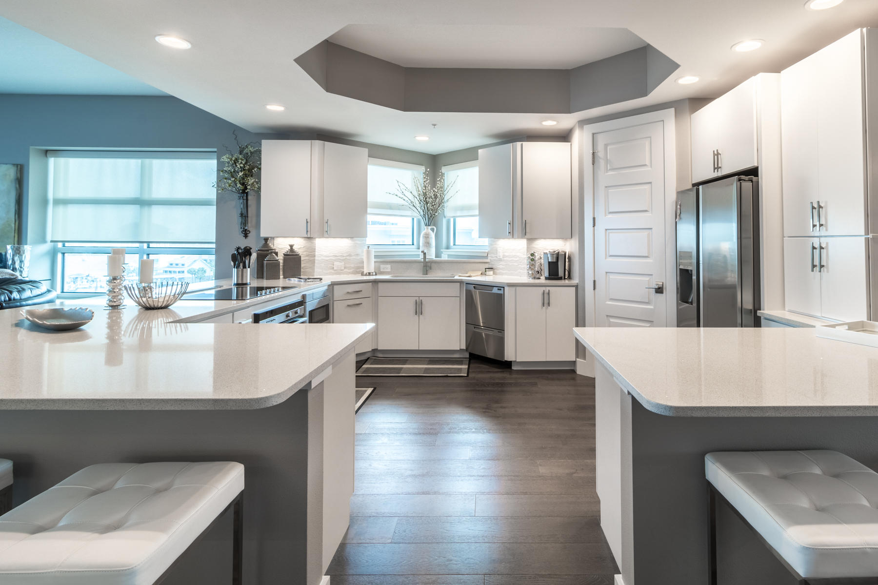 211 Durango Road, Unit 617 Destin, FL 32541 - Photo 7 of 56 a large kitchen with kitchen island a sink table and chairs