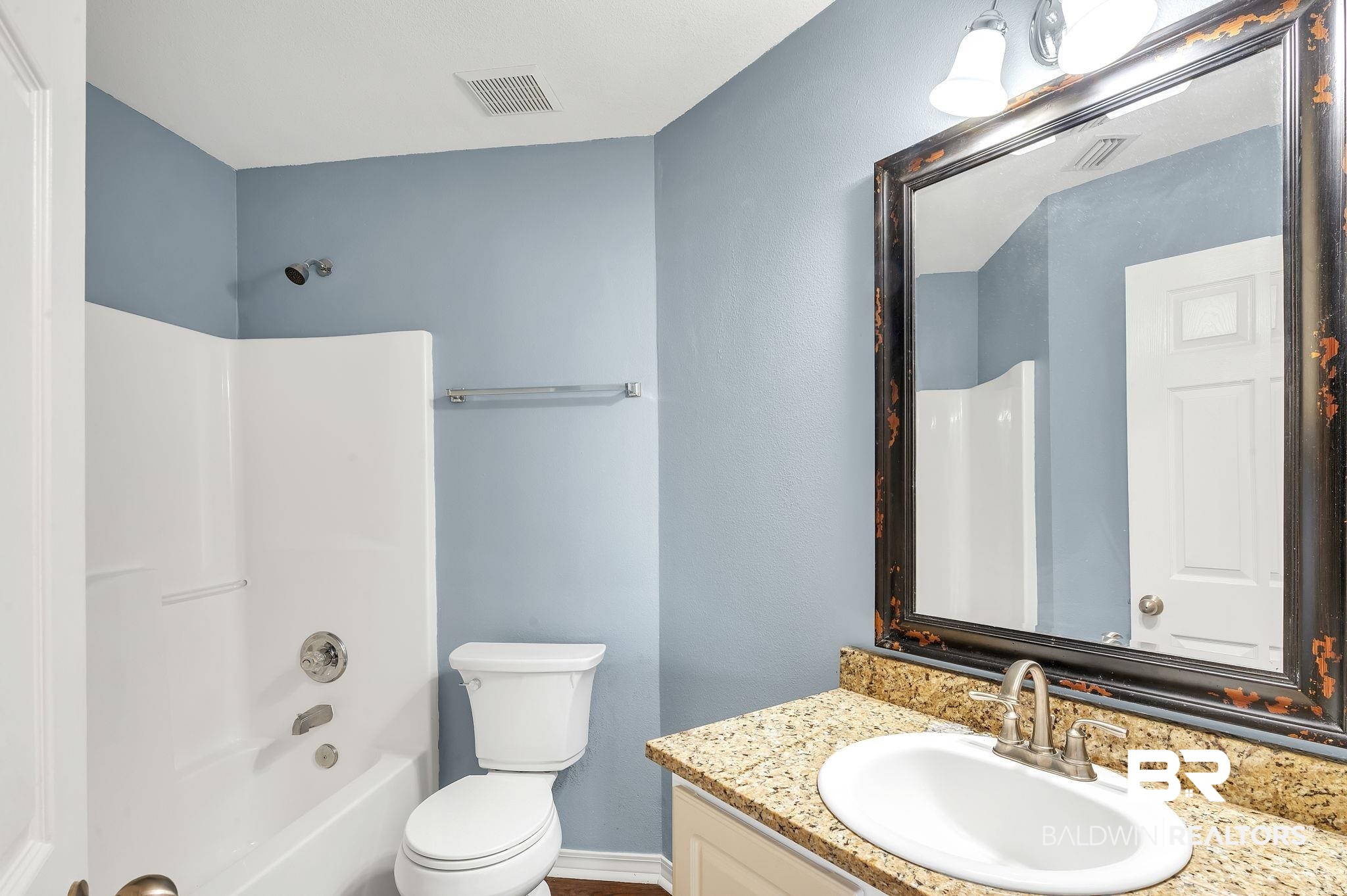 16444 Hamlet Lane Foley, AL 36535 - Photo 32 of 49 Bathroom with washtub / shower combination, visible vents, toilet, and vanity