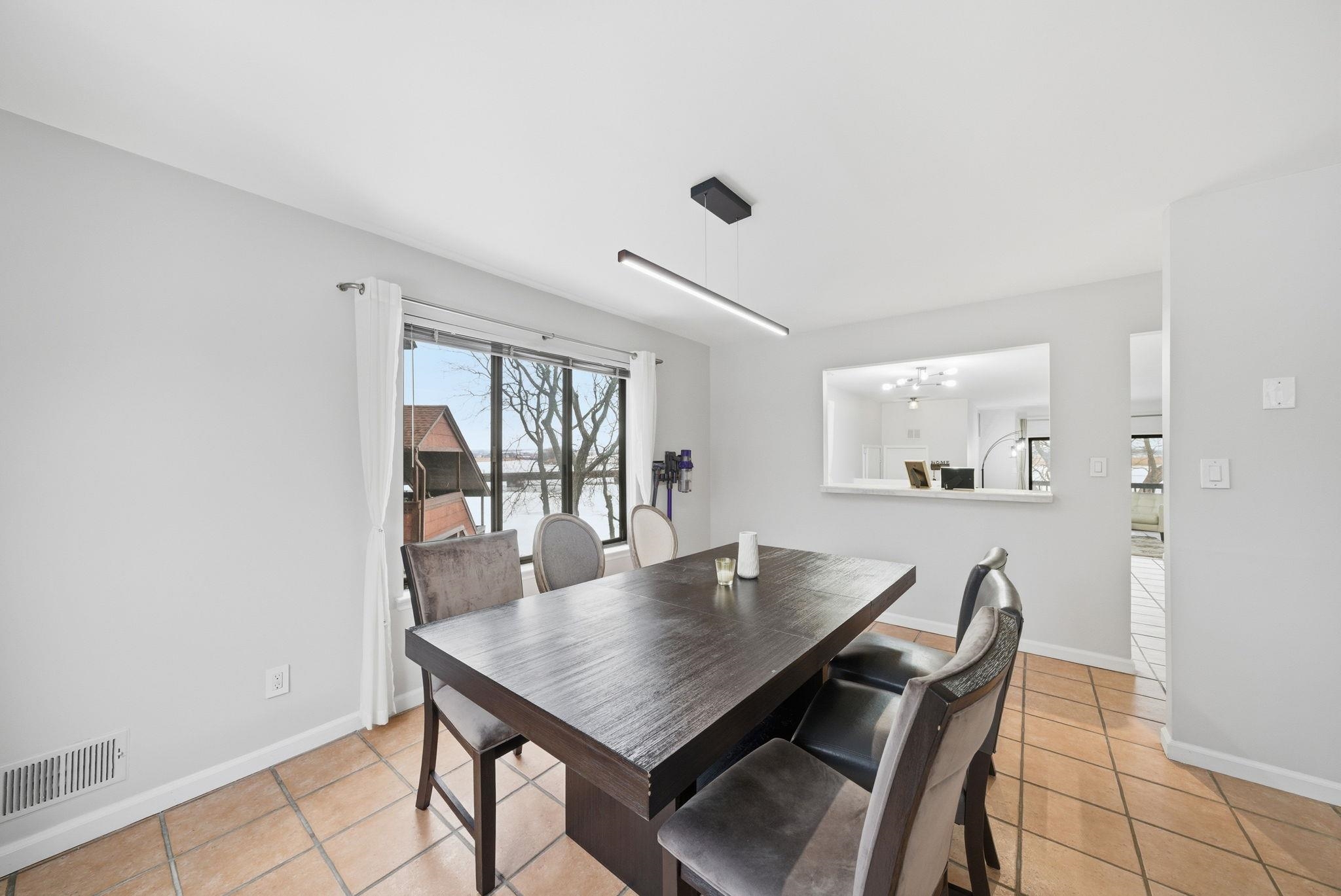 274 Sunset Key, Unit 274 Secaucus, NJ 07094 - Photo 13 of 50 a view of a dining room with furniture