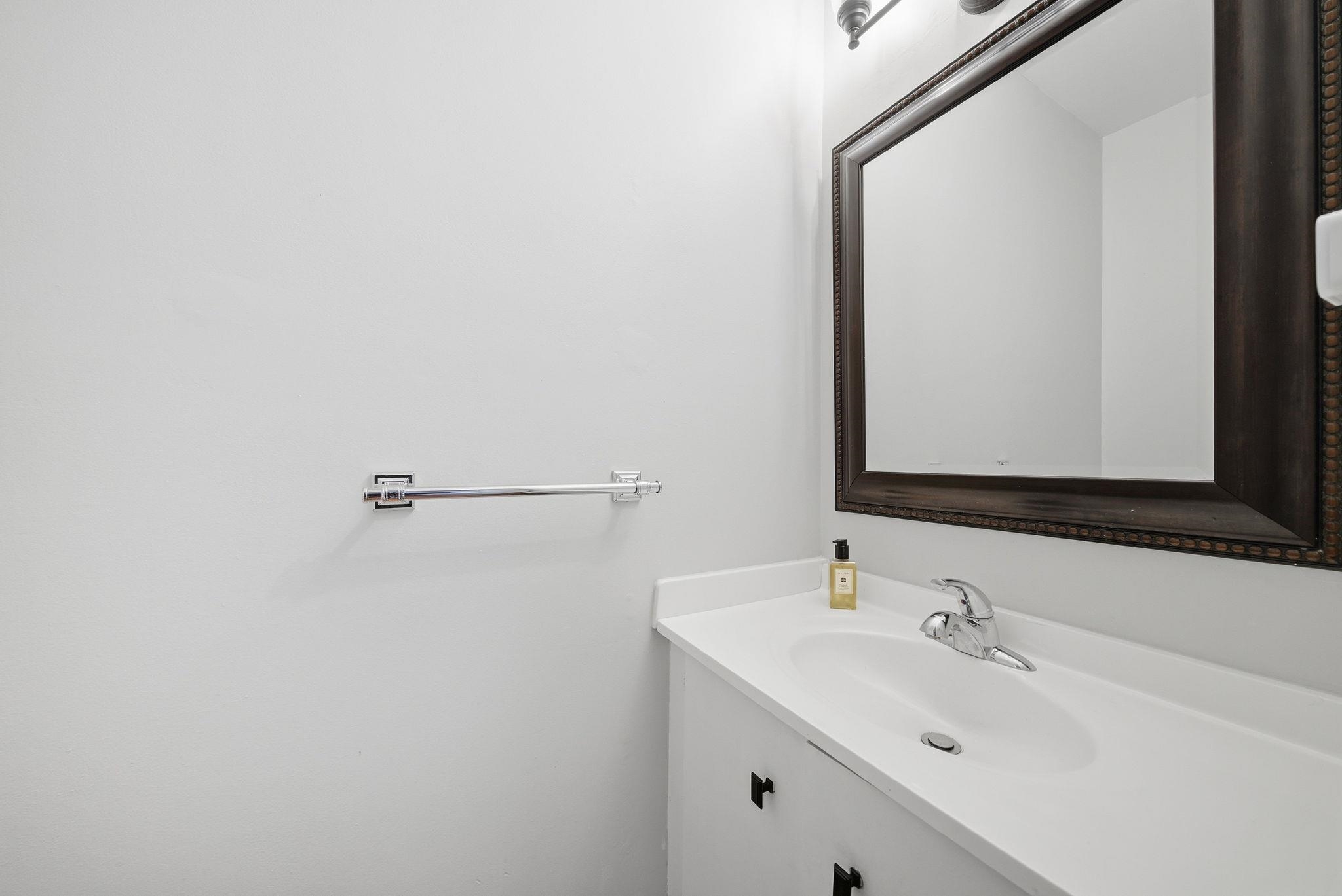 274 Sunset Key, Unit 274 Secaucus, NJ 07094 - Photo 17 of 50 a bathroom with a sink and a mirror