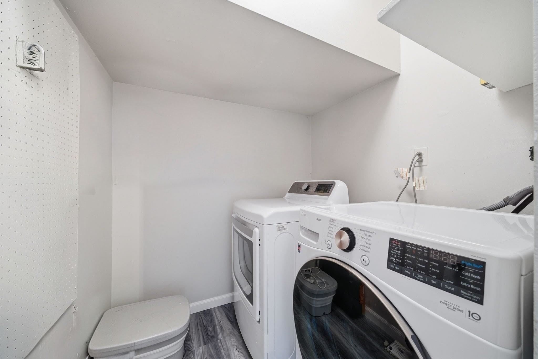 274 Sunset Key, Unit 274 Secaucus, NJ 07094 - Photo 19 of 50 a utility room with dryer and washer