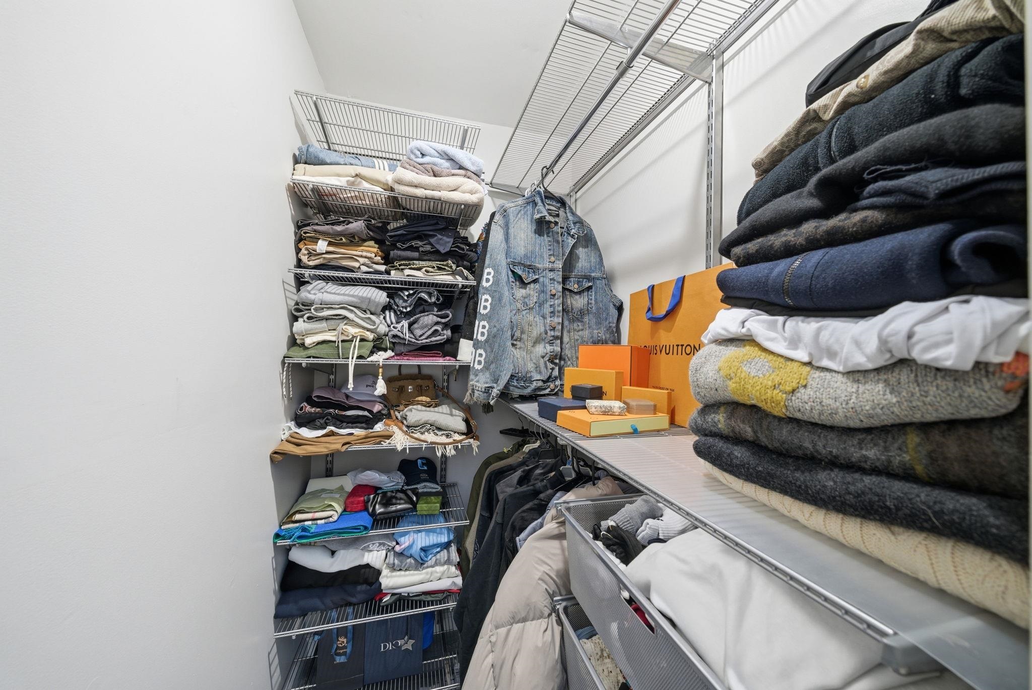 274 Sunset Key, Unit 274 Secaucus, NJ 07094 - Photo 23 of 50 a view of walk in closet with clothes and shoes