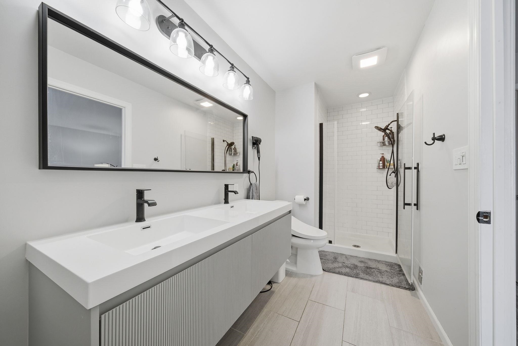 274 Sunset Key, Unit 274 Secaucus, NJ 07094 - Photo 25 of 50 a bathroom with a sink and a mirror