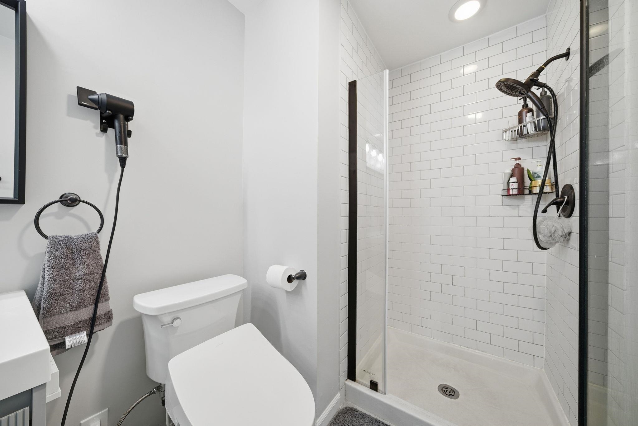 274 Sunset Key, Unit 274 Secaucus, NJ 07094 - Photo 27 of 50 a white toilet sitting next to a bathroom sink