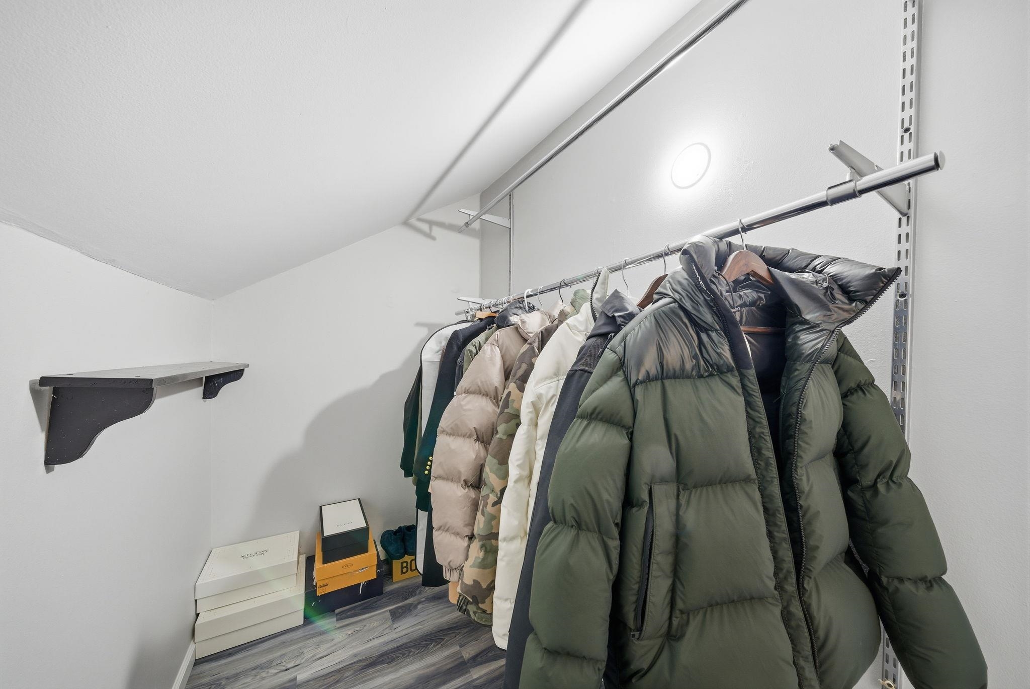 274 Sunset Key, Unit 274 Secaucus, NJ 07094 - Photo 29 of 50 a view of walk in closet with clothes and shoes