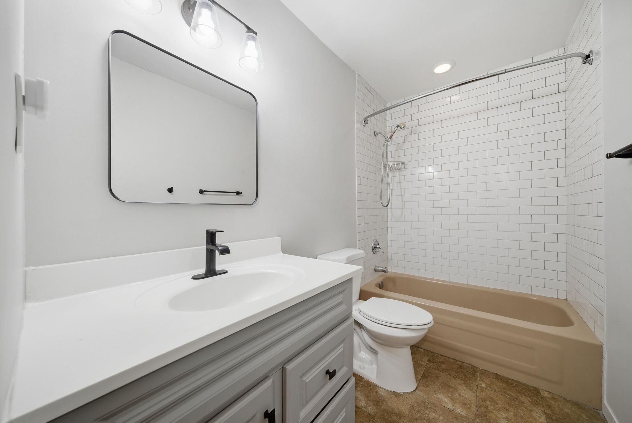 274 Sunset Key, Unit 274 Secaucus, NJ 07094 - Photo 30 of 50 a bathroom with a sink a toilet and a mirror