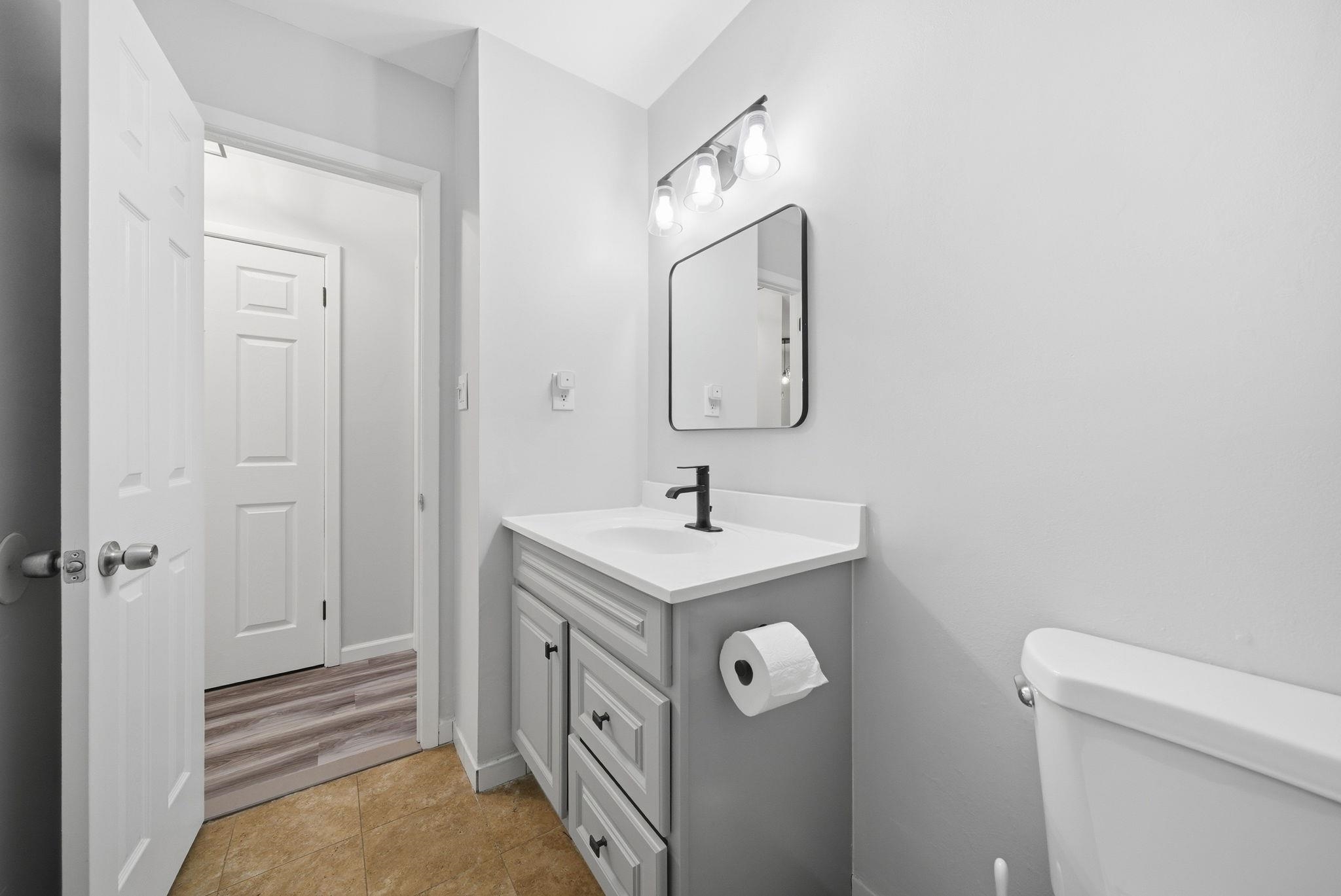 274 Sunset Key, Unit 274 Secaucus, NJ 07094 - Photo 31 of 50 a bathroom with a sink a toilet and mirror