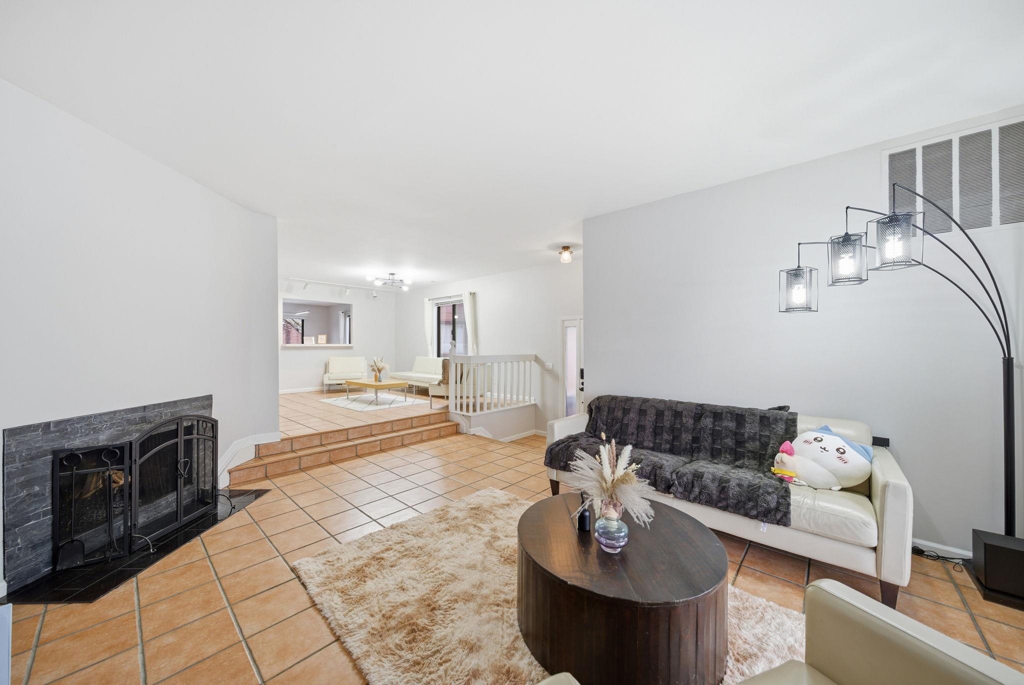 274 Sunset Key, Unit 274 Secaucus, NJ 07094 - Photo 5 of 50 a living room with furniture and a fireplace