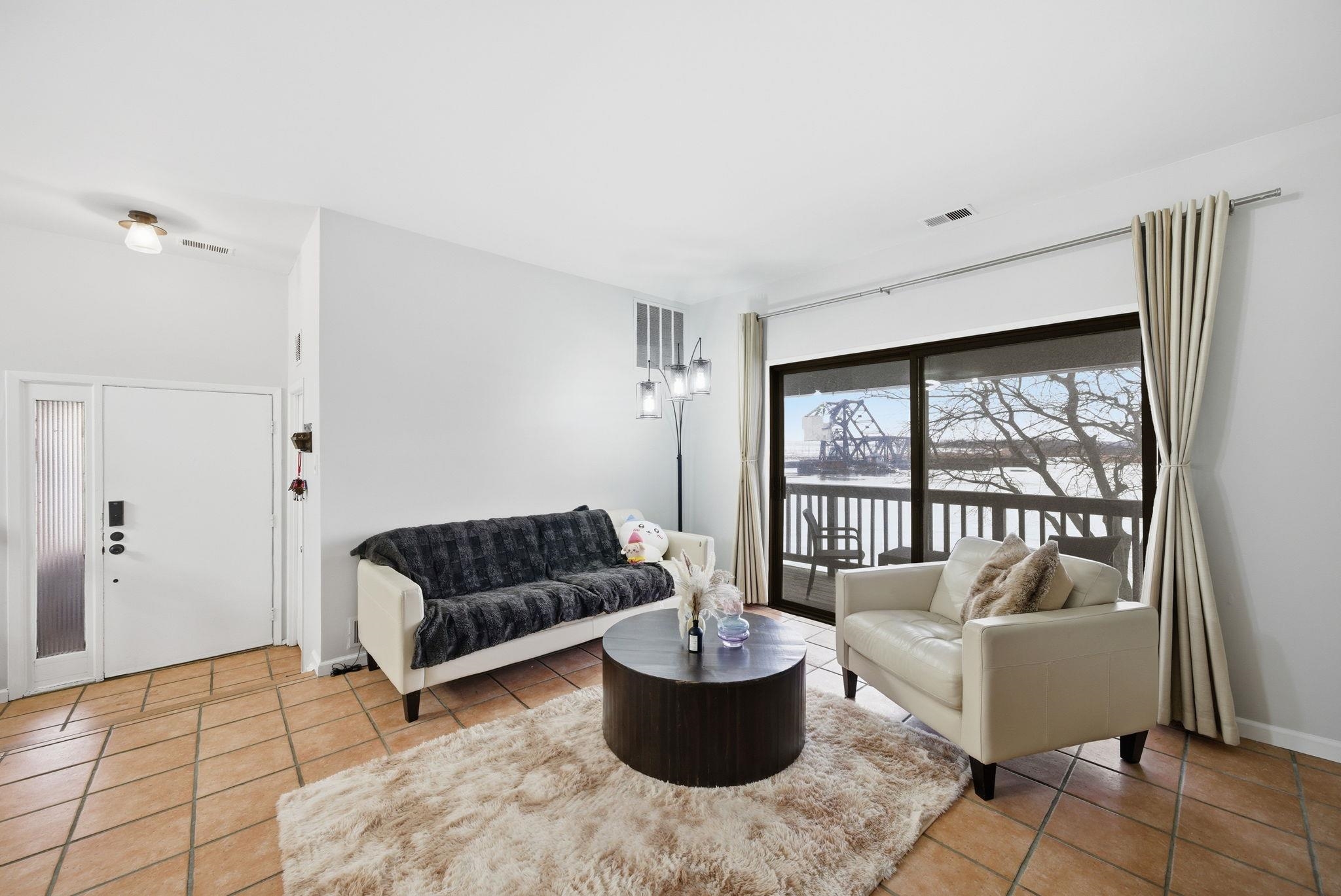 274 Sunset Key, Unit 274 Secaucus, NJ 07094 - Photo 7 of 50 a living room with furniture and a window