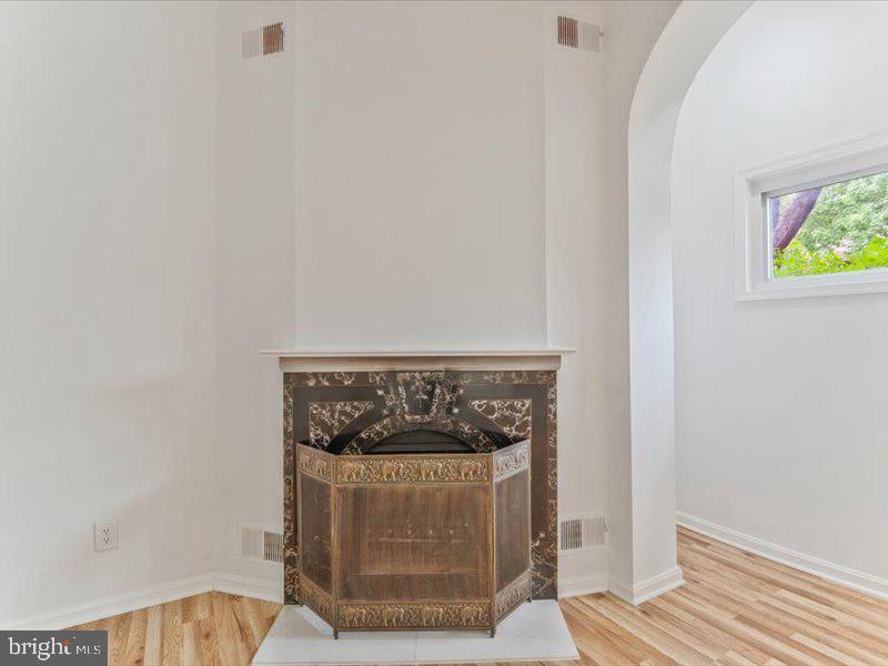 1200 D Street Northeast Washington, DC 20002 - Photo 19 of 47 Charming fireplace in a bright space.