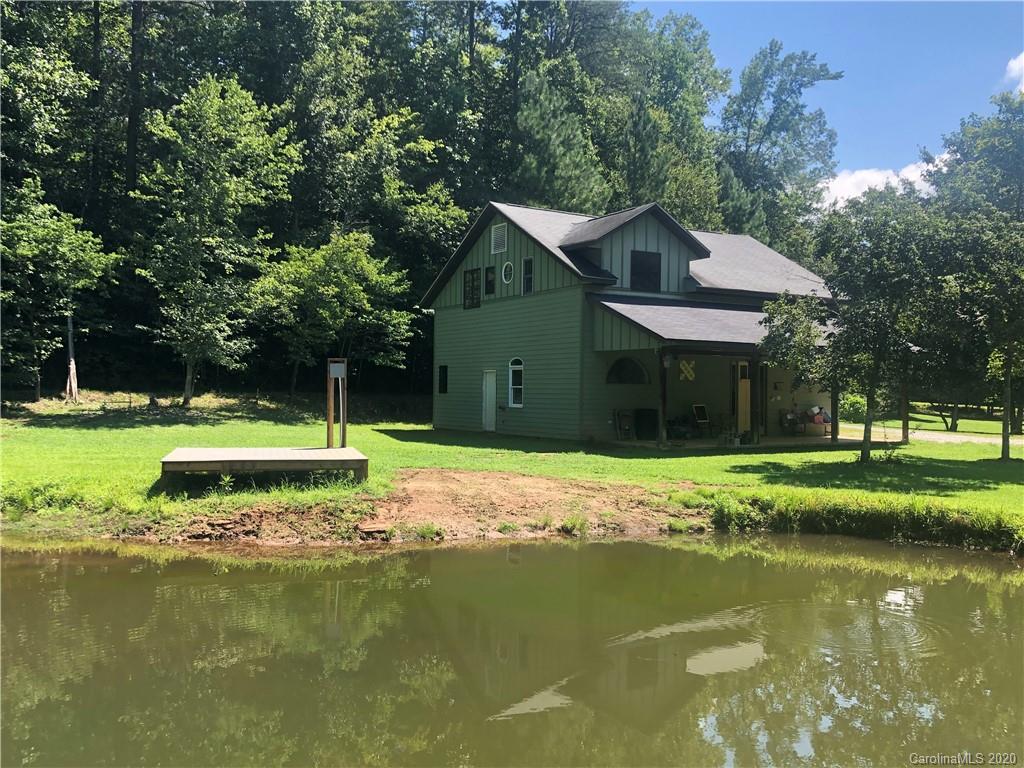 1117 Ponder Road Mill Spring, NC 28756 - Photo 1 of 39 a view of a house with a yard