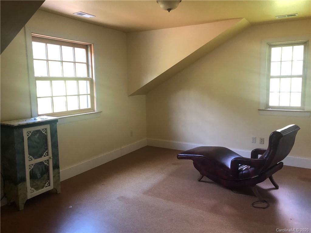 1117 Ponder Road Mill Spring, NC 28756 - Photo 22 of 39 a room with furniture and windows