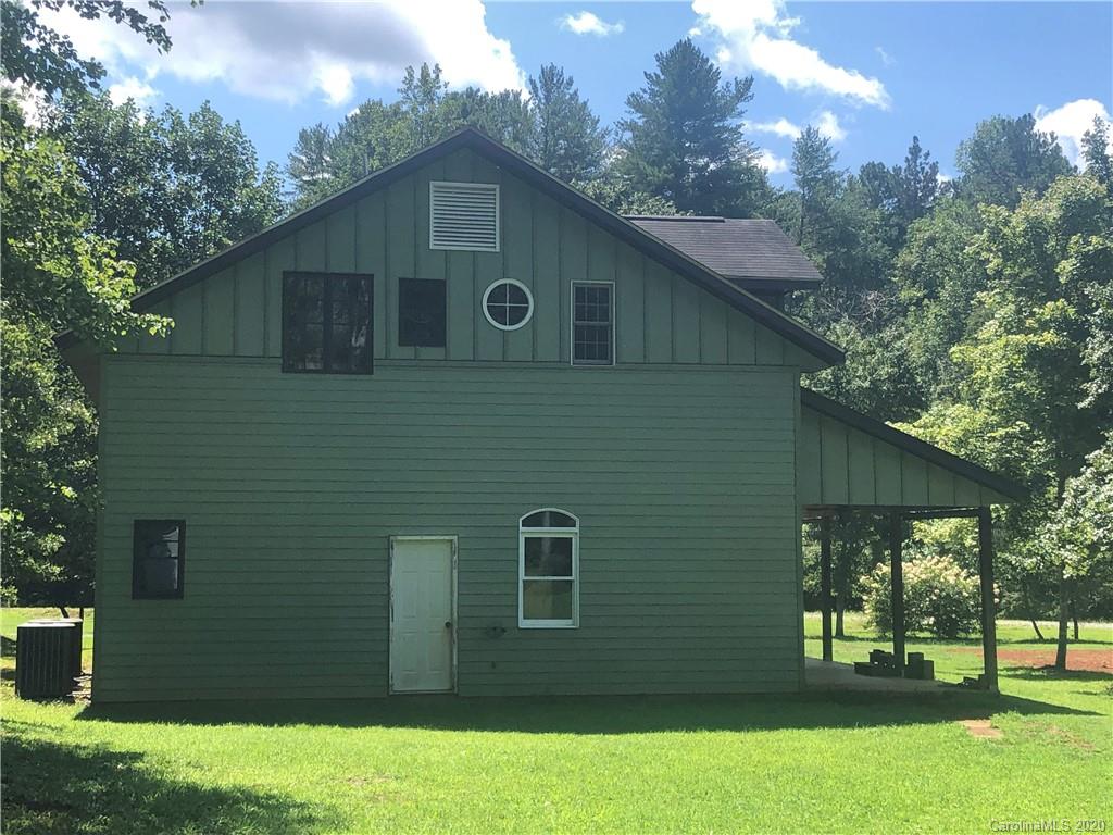 1117 Ponder Road Mill Spring, NC 28756 - Photo 29 of 39 a front view of a house with a yard