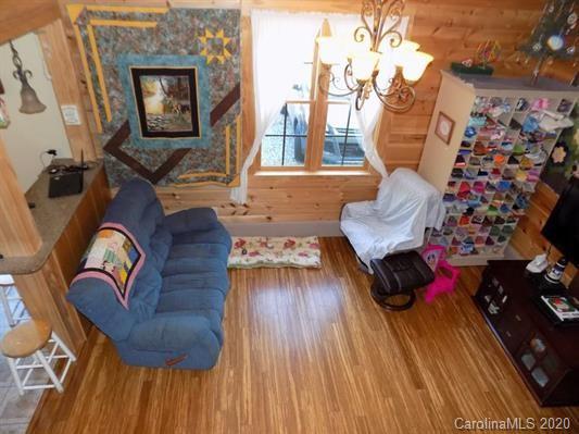 1117 Ponder Road Mill Spring, NC 28756 - Photo 8 of 39 a view of living room filled with furniture and wooden floor