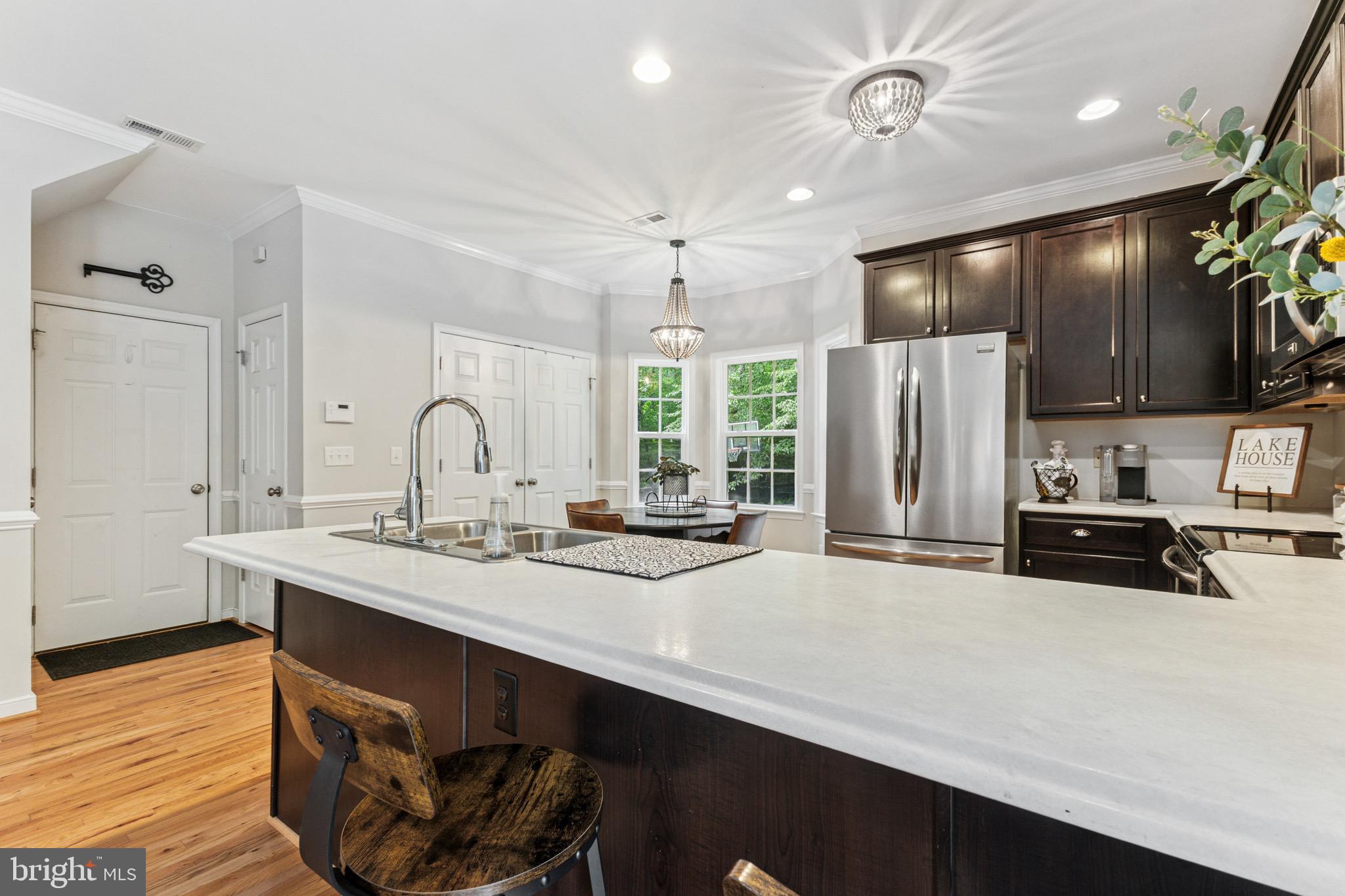 6108 Bills Road Mineral, VA 23117 - Photo 11 of 43 a kitchen with stainless steel appliances a sink stove and refrigerator