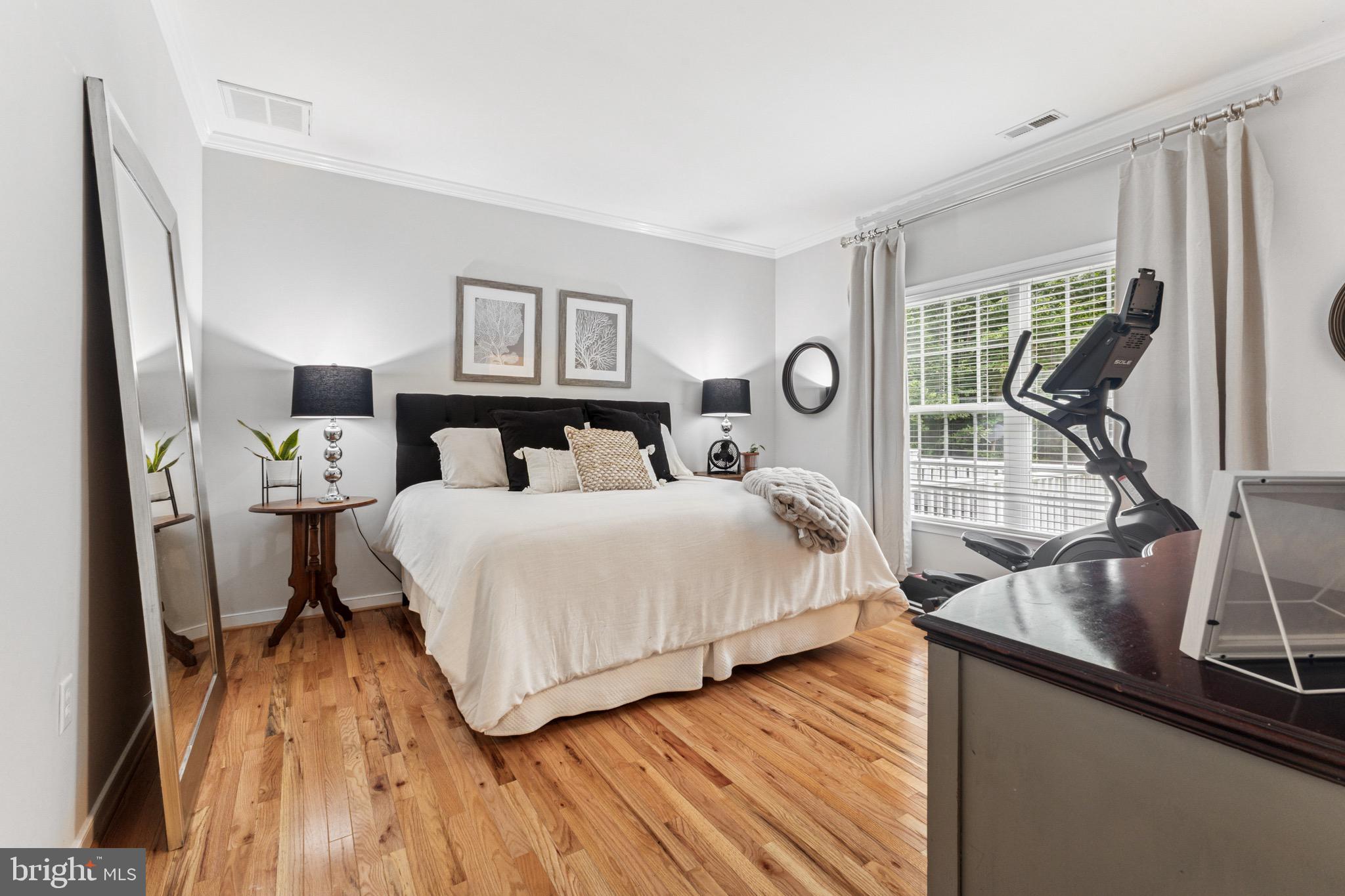 6108 Bills Road Mineral, VA 23117 - Photo 19 of 43 a bedroom with a bed and a wooden floor