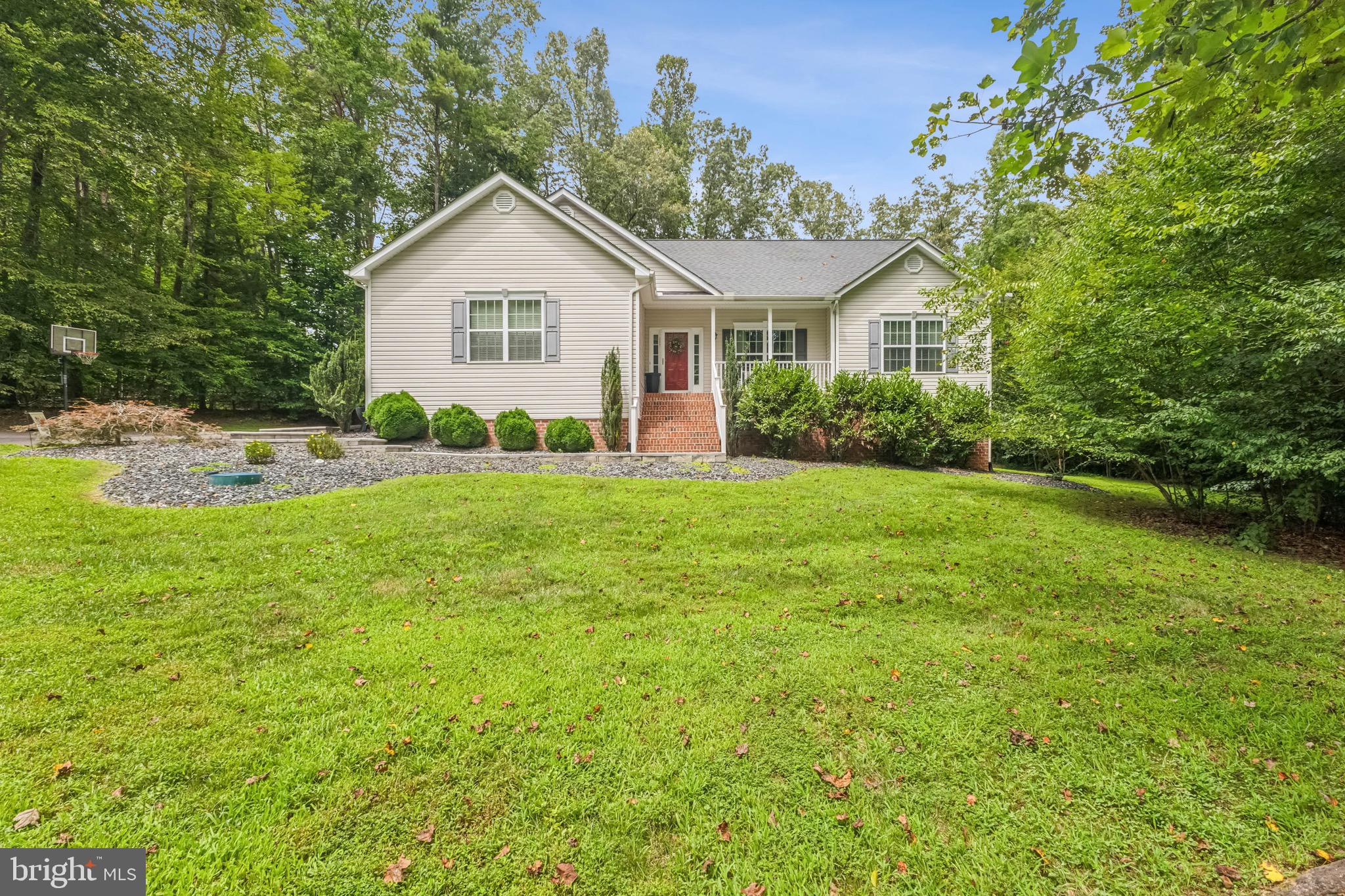 6108 Bills Road Mineral, VA 23117 - Photo 2 of 43 a view of a house with a yard and garage