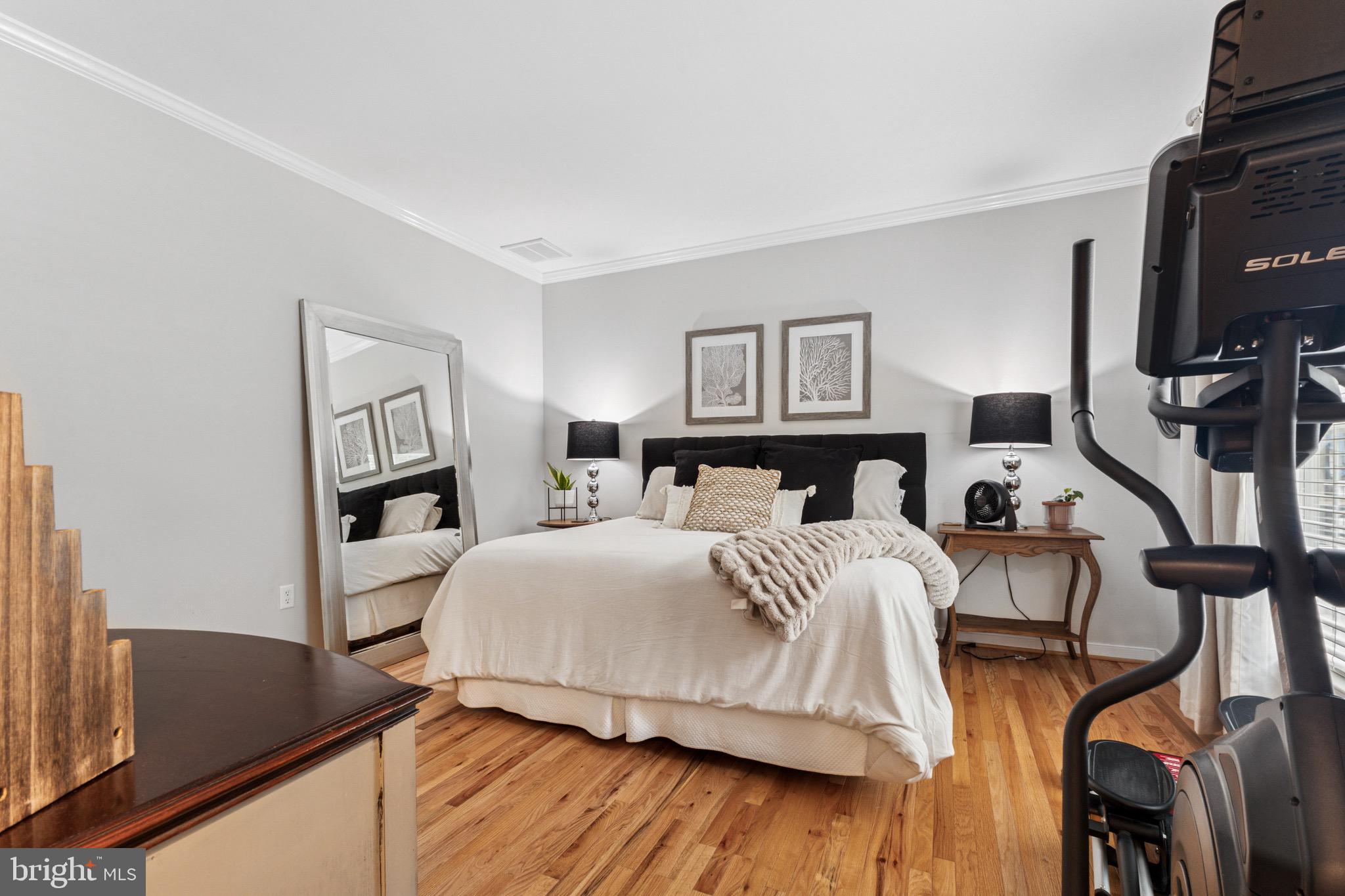 6108 Bills Road Mineral, VA 23117 - Photo 21 of 43 a bedroom with a bed and a flat tv screen on the dresser