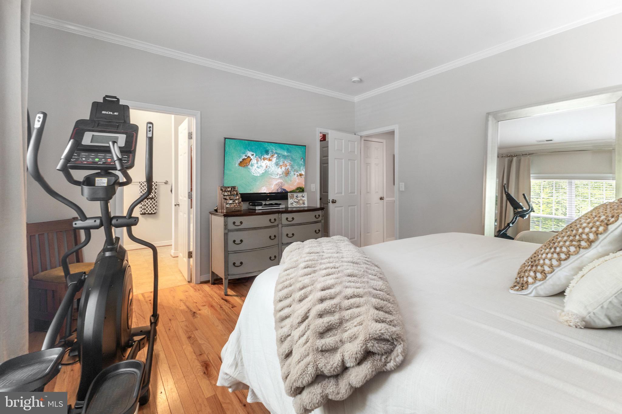 6108 Bills Road Mineral, VA 23117 - Photo 22 of 43 a bedroom with a bed and a flat tv screen on a dresser