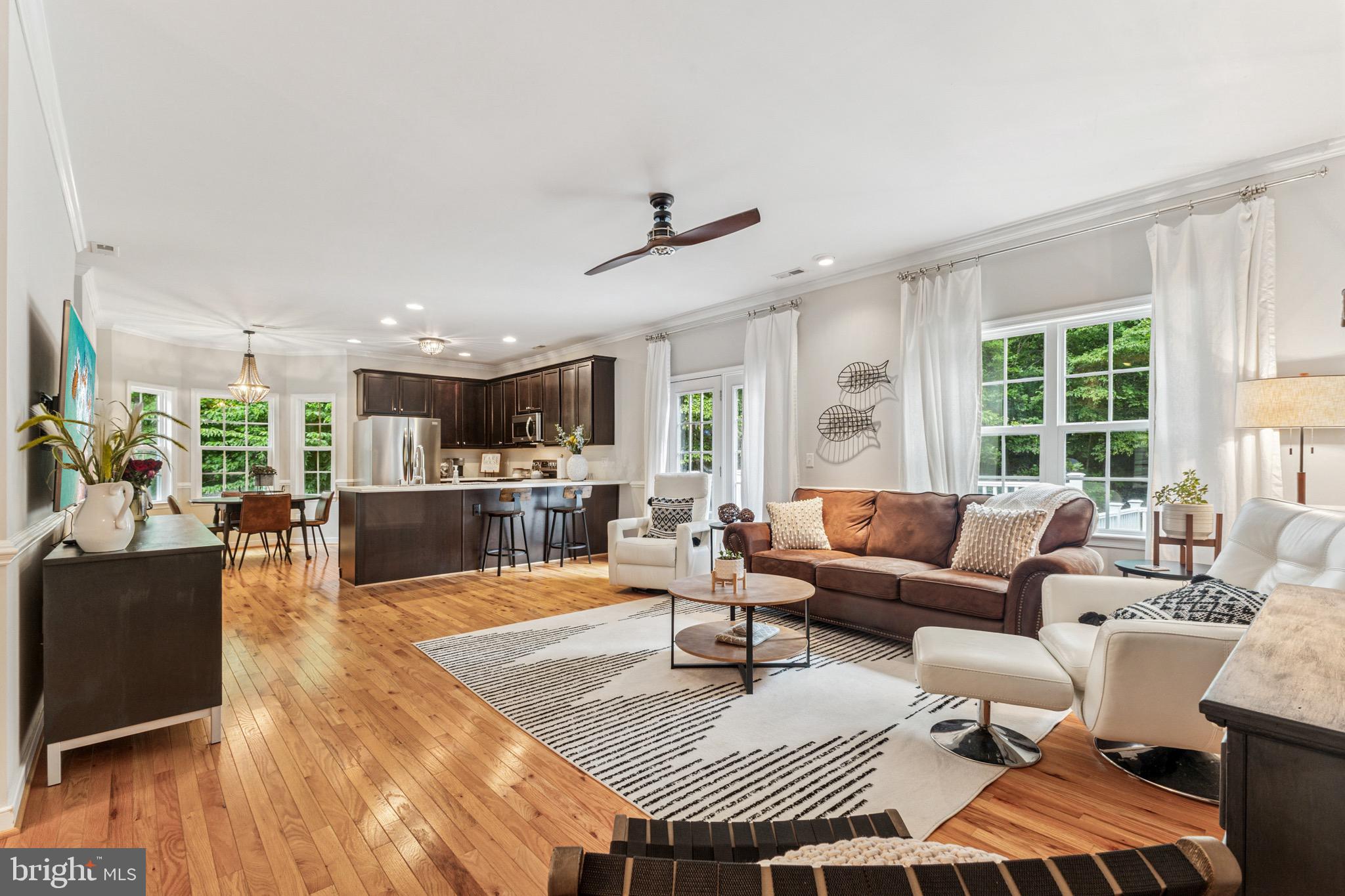 6108 Bills Road Mineral, VA 23117 - Photo 10 of 43 a living room with furniture a large window and wooden floor