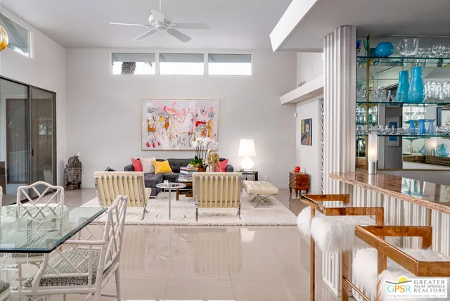 a kitchen with stainless steel appliances granite countertop a sink and a stove