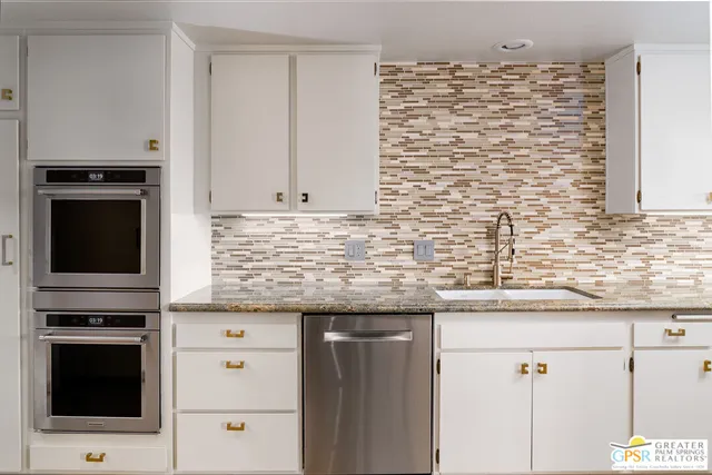 a kitchen with a table and chairs